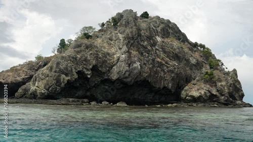 Castaway Qalito Malolo Island Tourism Fiji boat ride sailboat Roro Reef coral white sandy shores rocky boulder hillside tropical palm tree paradise Mamanuca group nature landscape ocean breeze static photo