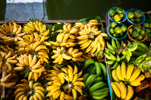 fresh produce on sale on floating market in Thainland photo