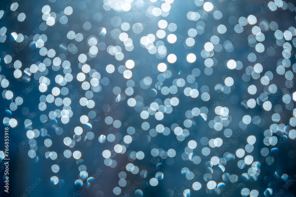 Extreme close-up of raindrops on window glass illuminated by the sun. Extreme close-up of raindrops on window glass illuminated by the sun.