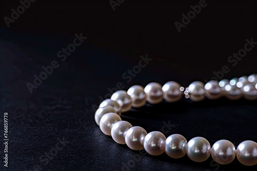 Isolated pearl necklace on black background
