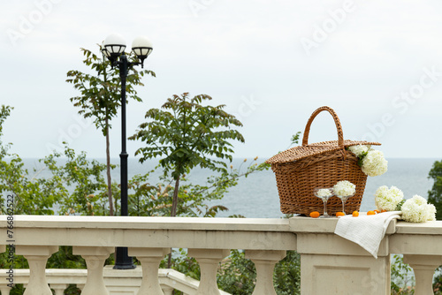 A picnic for two, in the summer, with a view of the sea. photo