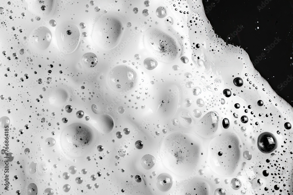 Top view, liquid white foam from soap or shampoo isolated on a black background Top view, liquid white foam from soap or shampoo isolated on a black background