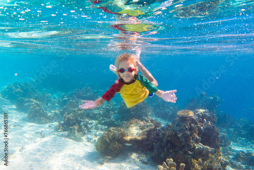 Child snorkeling. Kids underwater. Beach and sea.