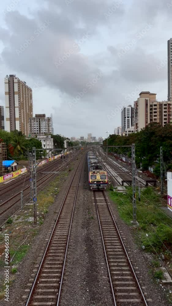 Mumbai Local Train Passing Through Stormy Skies Mumbai Local Train Passing Through Stormy Skies
