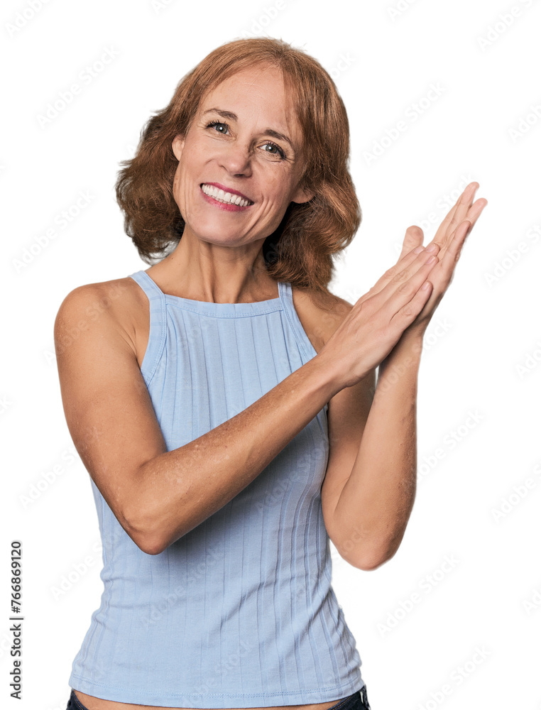 Redhead mid-aged Caucasian woman in studio feeling energetic and comfortable, rubbing hands confident. Redhead mid-aged Caucasian woman in studio feeling energetic and comfortable, rubbing hands confident.