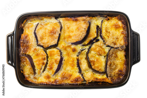 top view of Greek moussaka with layers of eggplant, potatoes, ground meat (usually beef or lamb), and béchamel sauce, baked until golden brown.