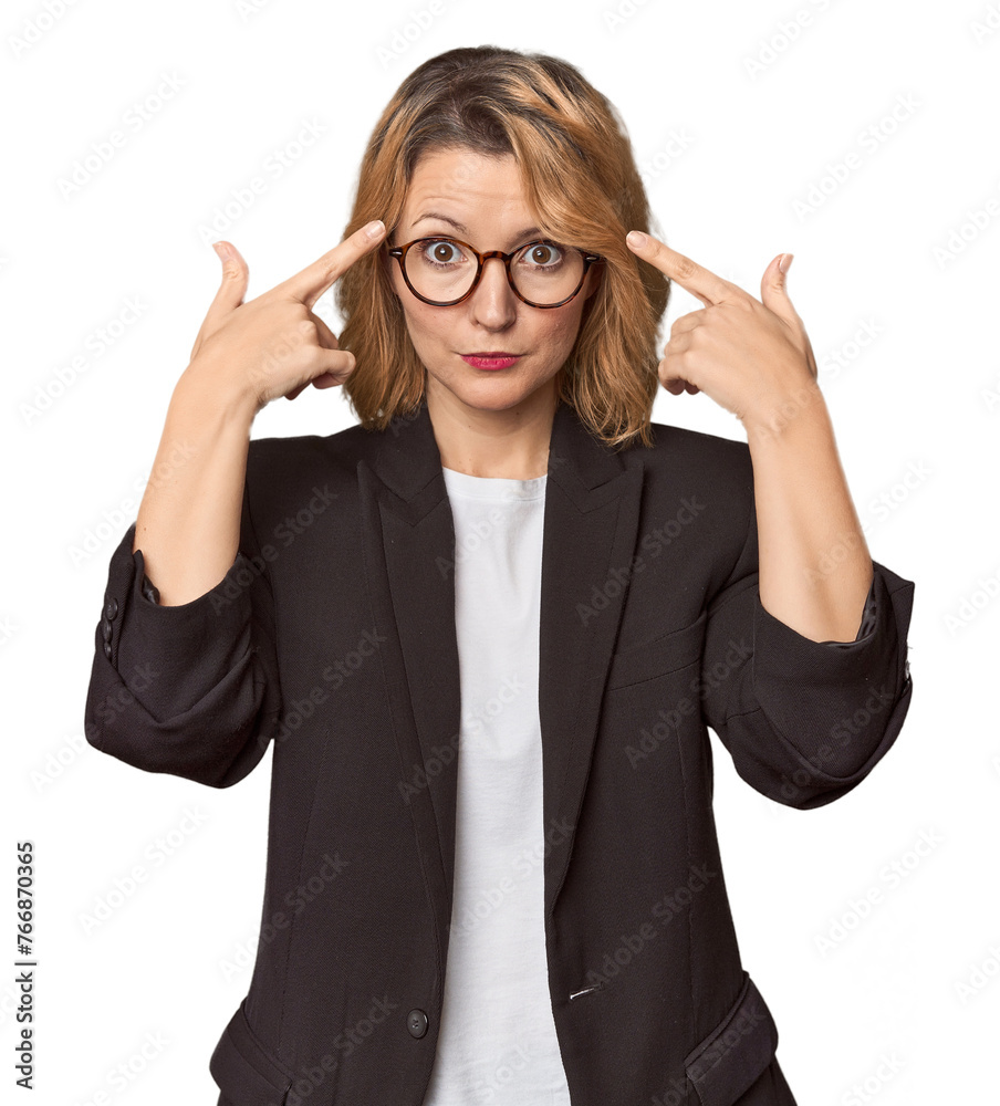 Caucasian woman in black business suit focused on a task, keeping forefingers pointing head. Caucasian woman in black business suit focused on a task, keeping forefingers pointing head.