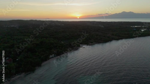 Aerial shot of the landscape of Paliton Beach during sunset. photo