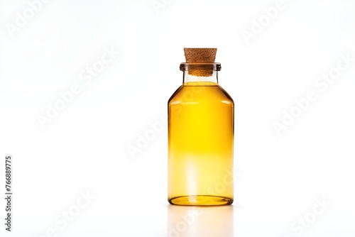 Glass bottle with yellow liquid on a white background