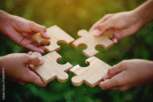 Jigsaw puzzle pieces of cooperation and teamwork Aim for great success in work.
