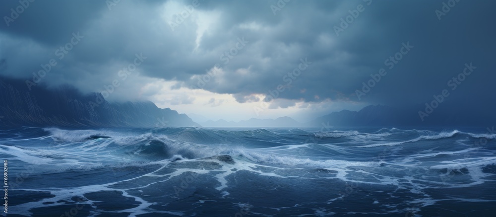 A turbulent ocean with wind waves crashing against the shore under a cloudy cumulusfilled sky, creating a dramatic natural landscape