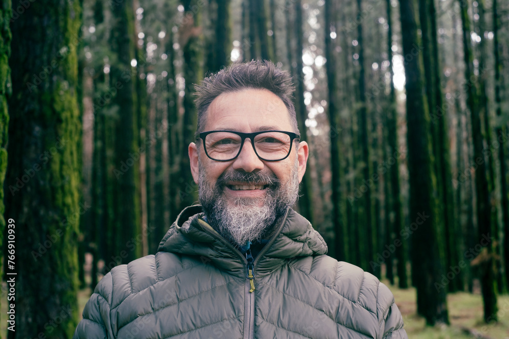Bearded man wearing eyeglasses in forest Bearded man wearing eyeglasses in forest