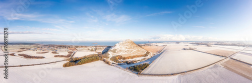 UK, Scotland, North Berwick, Aerial panorama of North Berwick Law hill and surrounding fields in winter photo
