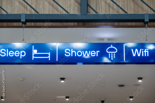 Istanbul, Turkey A sign inside the airport  at the Sabiha Gokcen Airport ( SAW) says Sleep, Shower and Wifi. photo
