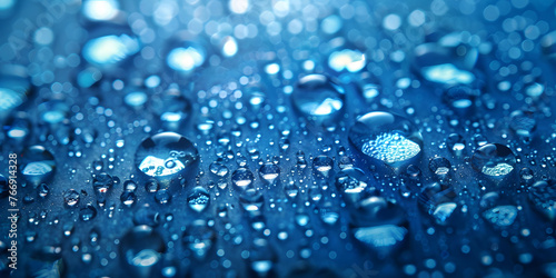 Close-up of refreshing water drops on a blue background