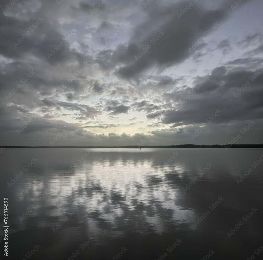 Stormy sky over a lake with clouds