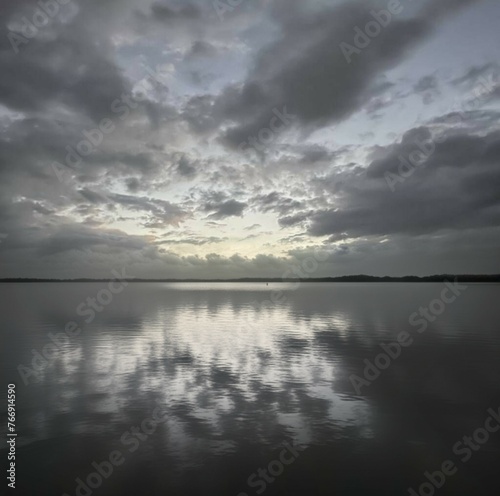 Stormy sky over a lake with clouds