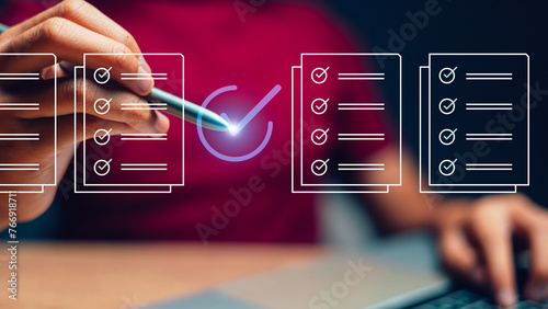 Prepare check and approve concepts. Document management, paperless. Women touching on virtual screen to tick mark documents for online approve paperless quality assurance and ERP management. photo