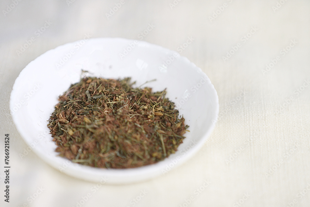 Dried Hypericum Perforatum, St. John's Wort in Bowl. Dried Hypericum Perforatum, St. John's Wort in Bowl.