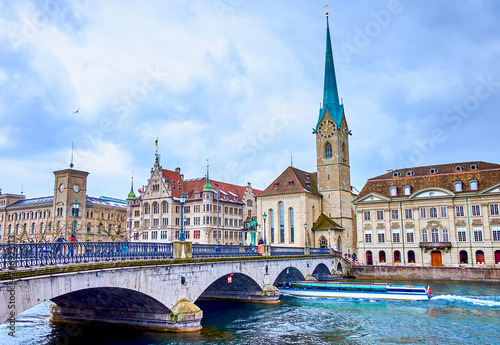 Munsterbrucke bridge that spans the Limmat River and stunning Fraumunster church, Zurich, Switzerland