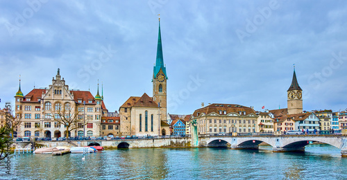 Panorama of the riverside housing of Limmat river with Peterskirche and Fraumunster churches, Zurich, Switzerland