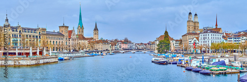 Zurich's iconic panorama showcases the Grossmünster and Fraumünster churches overlooking the Limmat River, Switzerland