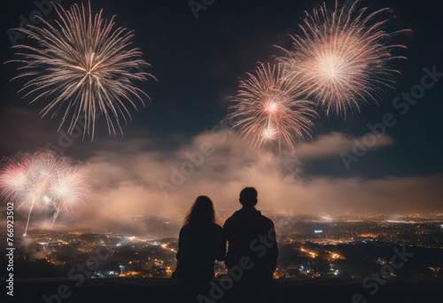 couple fom behind watching fireworks in the sky, breathtaking