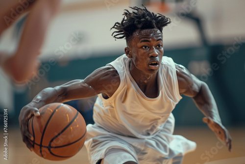A dynamic snapshot capturing a youthful basketballer skillfully maneuvering the ball on the court.