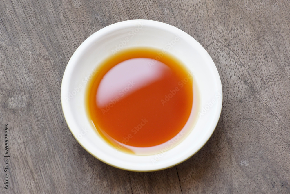 Phu Quoc Traditional Fish Sauce. Extract fish. Fish sauce in white bowl isolated. Phu Quoc Traditional Fish Sauce. Extract fish. Fish sauce in white bowl isolated.