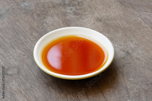 Phu Quoc Traditional Fish Sauce. Extract fish. Fish sauce in white bowl isolated.