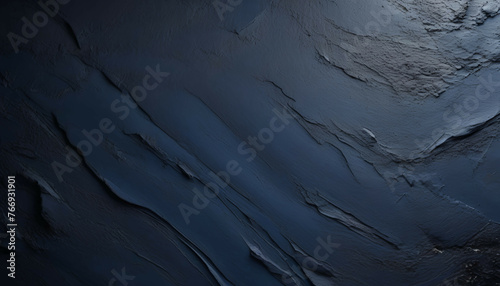 Background image of texture plaster on the wall in dark blue black tones in grunge style. 