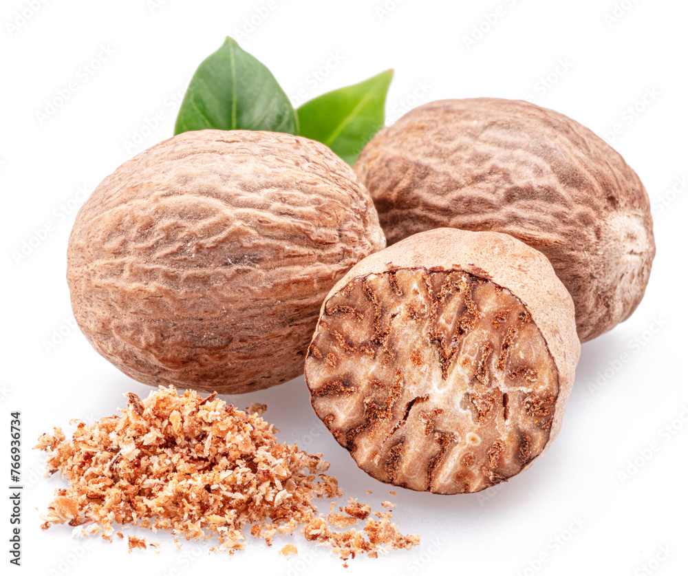 Nutmeg and ground nutmeg heap isolated on white background. Nutmeg and ground nutmeg heap isolated on white background.