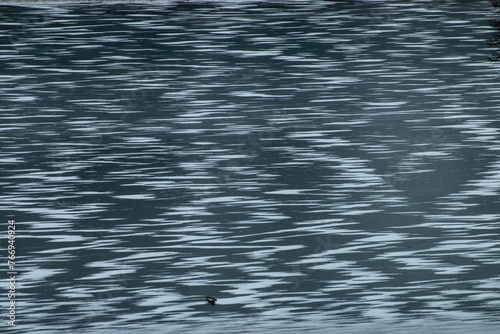 Scenic view of dark grey water with a rippling surface