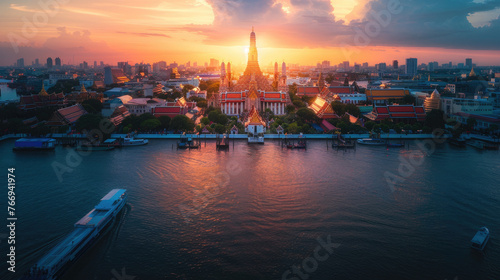 A panoramic view of Wat Arun temple at sunset in Bangkok  Thailand with the river and city in the background