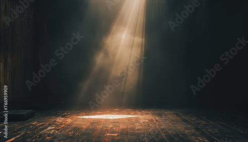 A stage with a blue curtain and a spotlight shining on it