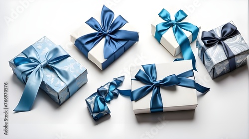 Isolated on a white background with empty space, a top view of blue and white giftboxes with a blue satin ribbon bow