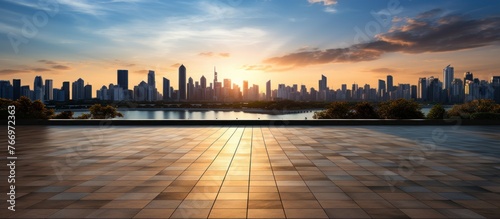 Empty floor and modern city skyline with building at sunset photo