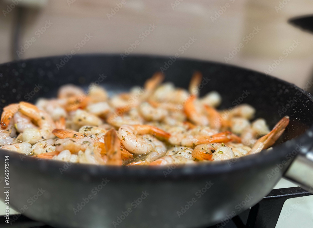 Macro photo of food, frying pan with shrimp. Cooking on the stove. Macro photo of food, frying pan with shrimp. Cooking on the stove.
