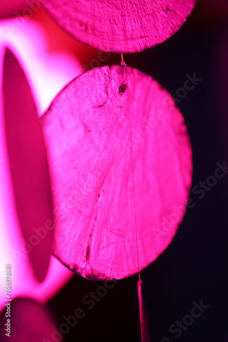 Home decoration close up detail Modern color pink on black background. Shading with reflection. The colors vary with position, producing smooth color transitions. Color neon pink gradient © m.zh