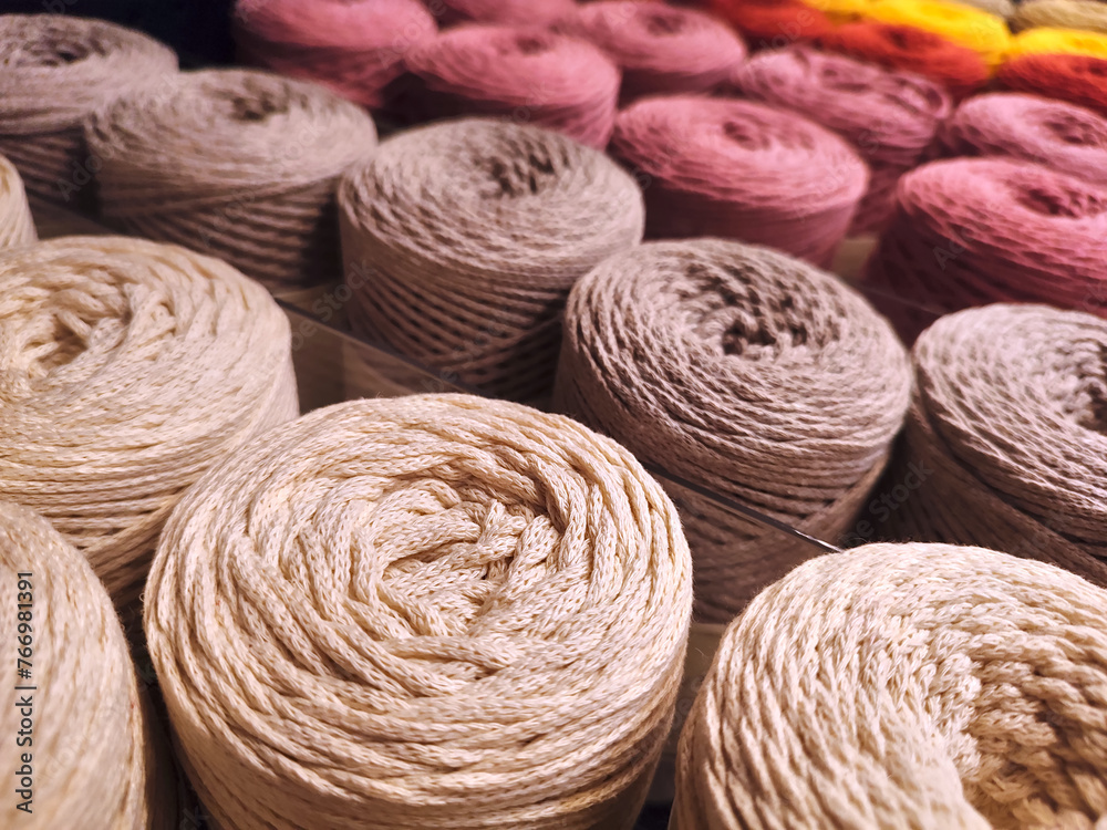 Rolls of macramé cotton rope in perspective