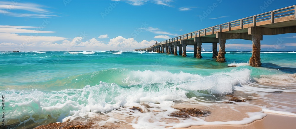 Bright seascape with surf waves crashing on sandy beach