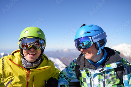 Summit Smiles: Ski Enthusiasts Enjoying the View © nuclear_lily