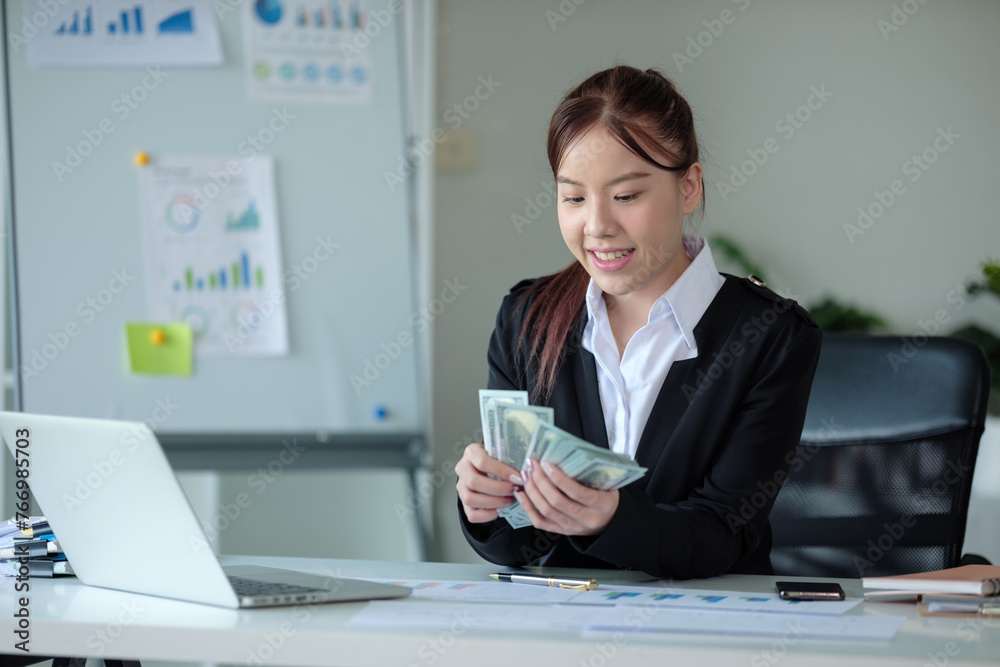 Rich wealthy business woman Asian businesswoman financial bookkeeper girl in an office entrepreneur counting money cash count salary profit finance jackpot earn investment budget dollars banknotes Rich wealthy business woman Asian businesswoman financial bookkeeper girl in an office entrepreneur counting money cash count salary profit finance jackpot earn investment budget dollars banknotes