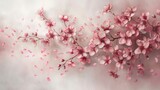 A branch of pink flowers stands out against a clean white background, showcasing delicate petals and vibrant colors