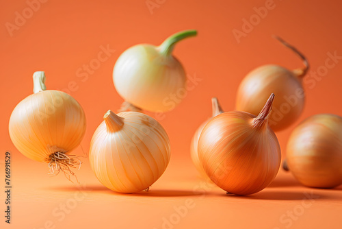 Floating red onions on a vivid orange gradient backdrop