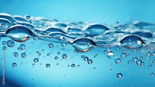 Close-up of water droplets on a reflective blue surface
