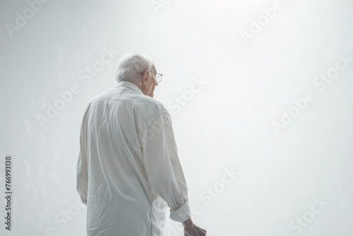 Man Holding Suitcase in White Shirt