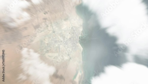 Earth zoom in from space to Al Wakrah, Qatar. Followed by zoom out through clouds and atmosphere into space. Satellite view. Travel intro. Images from NASA photo