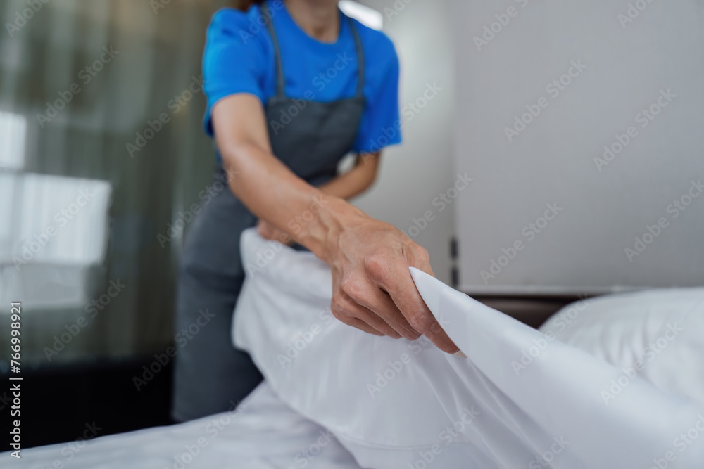 cleaning service woman worker clean bedroom at home. housekeeper cleaner feel happy and make bed look neat. housework and housekeeping cleaning service cleaning service woman worker clean bedroom at home. housekeeper cleaner feel happy and make bed look neat. housework and housekeeping cleaning service