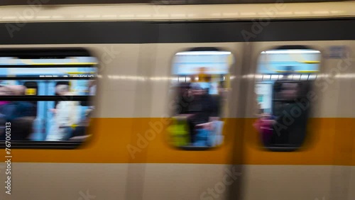 Milan, Italy 03.2024. Sign Duomo metro station in Milan. The metro train arrived at Duomo station. Subway car full of tourists